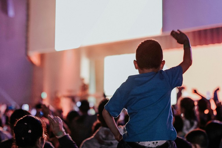 A child singing at an event